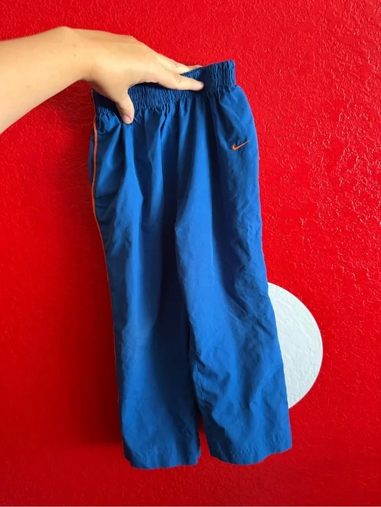Vintage Nike Kids Blue Track Pants with Orange Trim