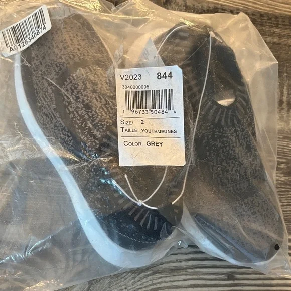 Brand New Kids Slip On black and grey sneakers.