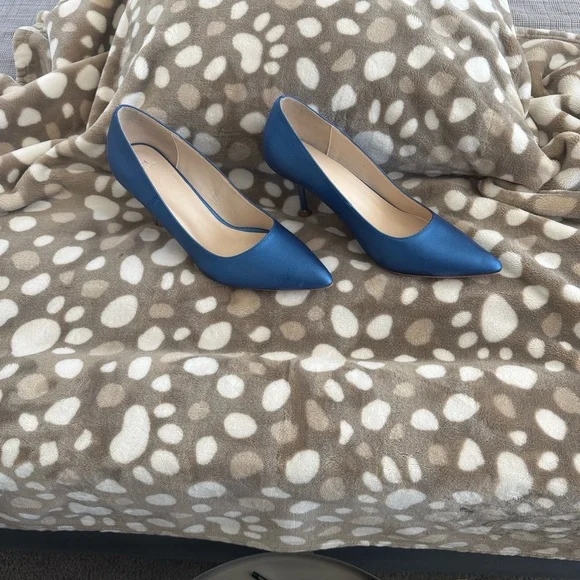 Vintage inspired elegance by Halston.  Vegan leather, rubber sole.