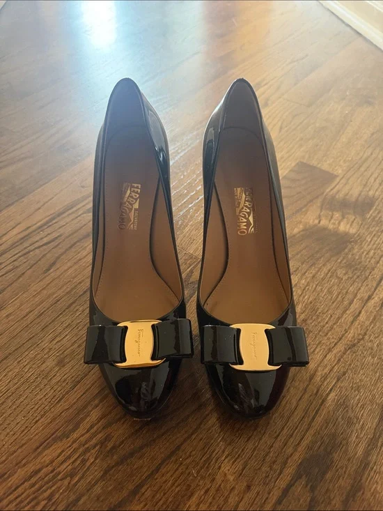 Salvatore Ferragamo Black Patent Vara Bow Pumps with Gold Plaque Accent