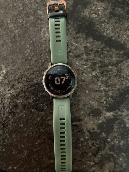 garmin Fenix Smartwatch with Green Silicone Band and Black Bezel