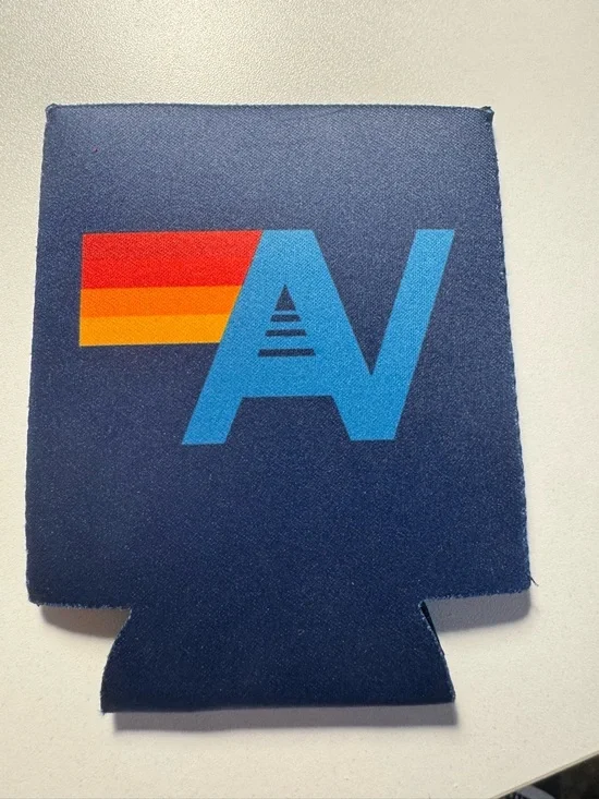 Aviator Nation Navy Can Cooler with Blue Logo and Red-Orange-Yellow Stripe
