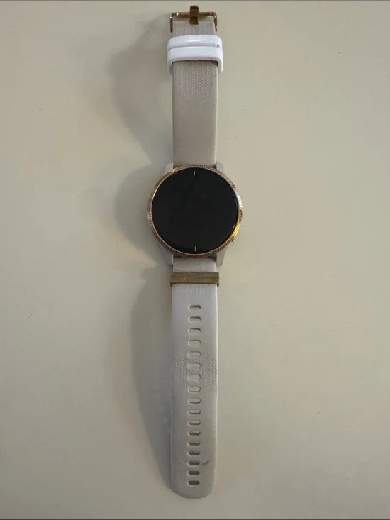 Garmin Venu Smartwatch with tan/cream Strap and rose gold Bezel