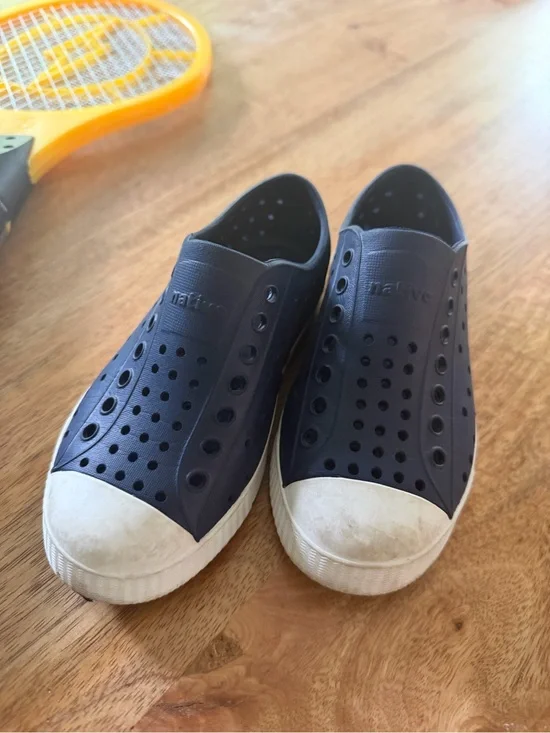 Native Kids Navy Slip-On Water Shoes with White Toe Caps on