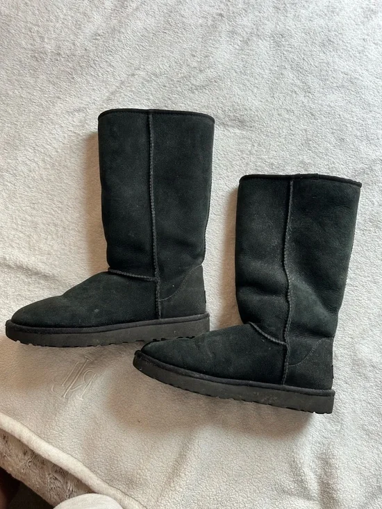 Tall black UGG boots