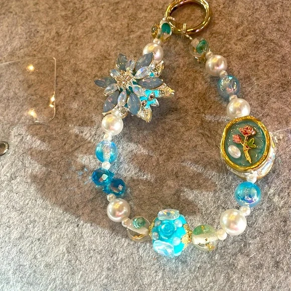 NEW Wristlet phone accessory with beads in varying blues
