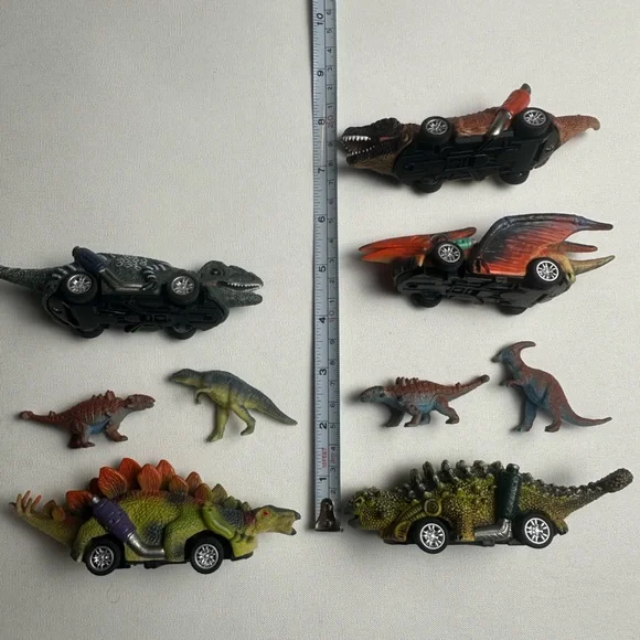 Bundle of multiple sized dinosaurs. 5 are wind up cars. See video.
