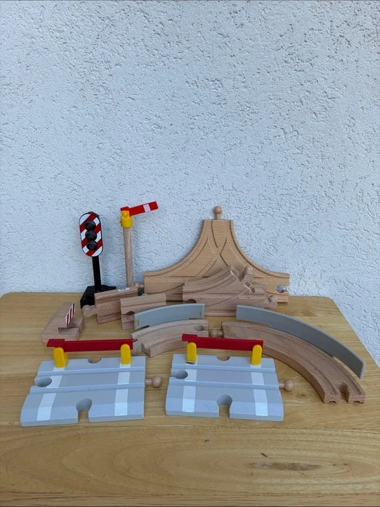 Wooden train tracks and light  Lot of 12 pieces. Great addition to your set!