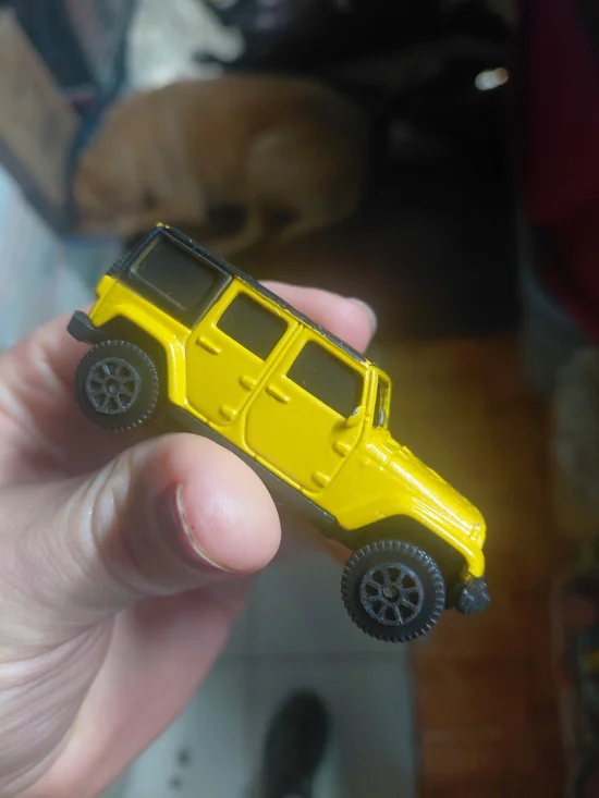 yellow 2015 Jeep Wrangler Unlimited toy car is a 1/64 scale diecast model produc