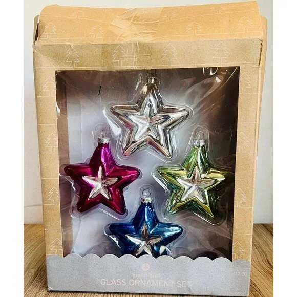 Handcrafted Glass Ornament Set features four star-shaped ornaments metallic