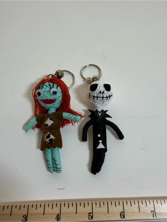Jack Skellington and Sally string doll keychains. Backpack