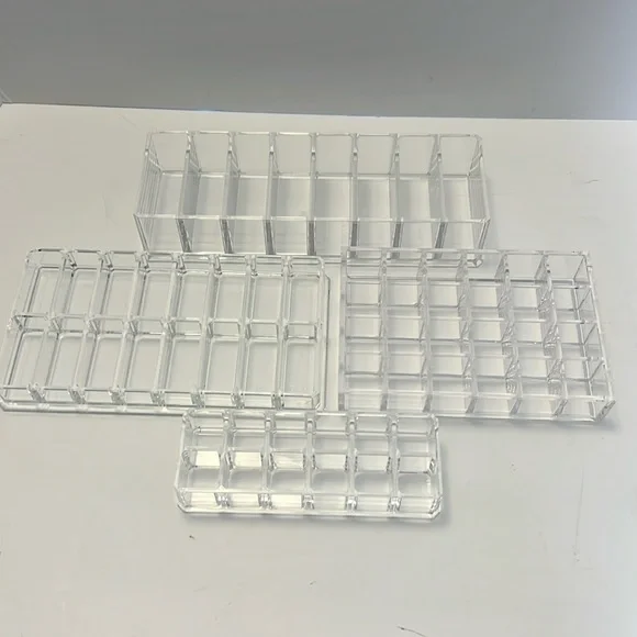 4 Lucite makeup organizers. Excellent condition