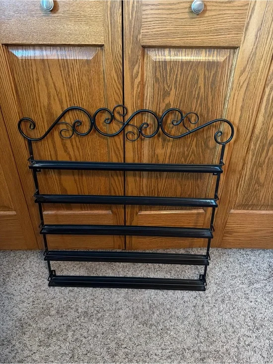 Black Metal Wall Nail Polish Shelf with Decorative Scroll Top