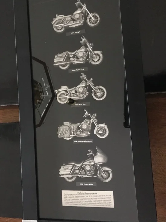 Framed Harley Davidson memorabilia