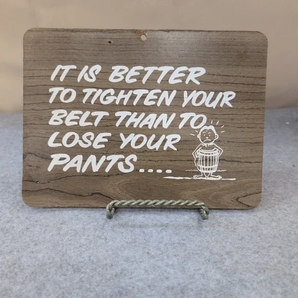VTG 1968-73 Pressboard KMart Wall Sign Plaque Tighten Belt or Lose Pants Quote‎