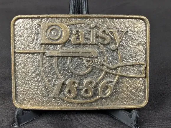 Vintage Daisy 1886 Brass Belt Buckle Manufactured by Astamar Boston Advertising