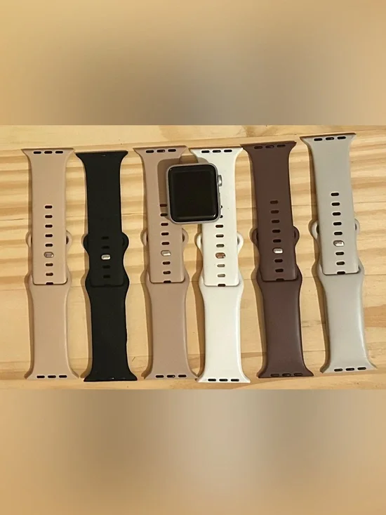 Apple Watch with Black, Beige, White and Brown Silicone Bands