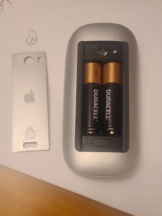 Apple Silver Magic Mouse with Exposed Battery Compartment and Duracell Cells