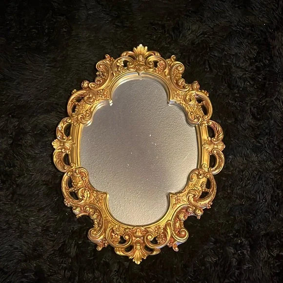 This a painted gold mirror I got at a market to match my dark academia aesthetic