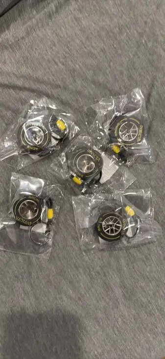 Invicta Racing F1 Rubber Medium Tire Yellow Striped Keychain IG0346