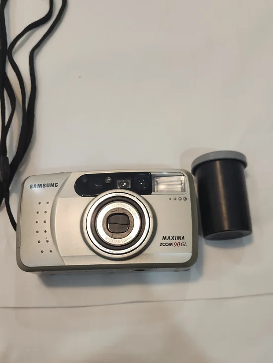 Samsung Silver Point-and-Shoot Film Camera with Black Film Canister