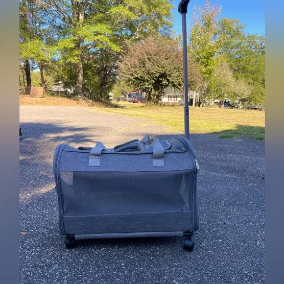 A pet travel carrier and roller. 2 doors on each side. Detachable roller base.