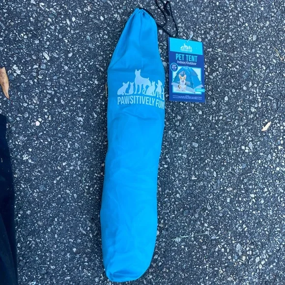 Here is a blue and gray pet tent. It’s very big and nice for an animal.