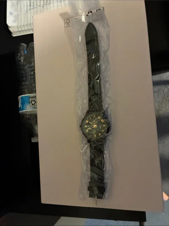 Genuine Merchandise Black Watch with Gold Accents