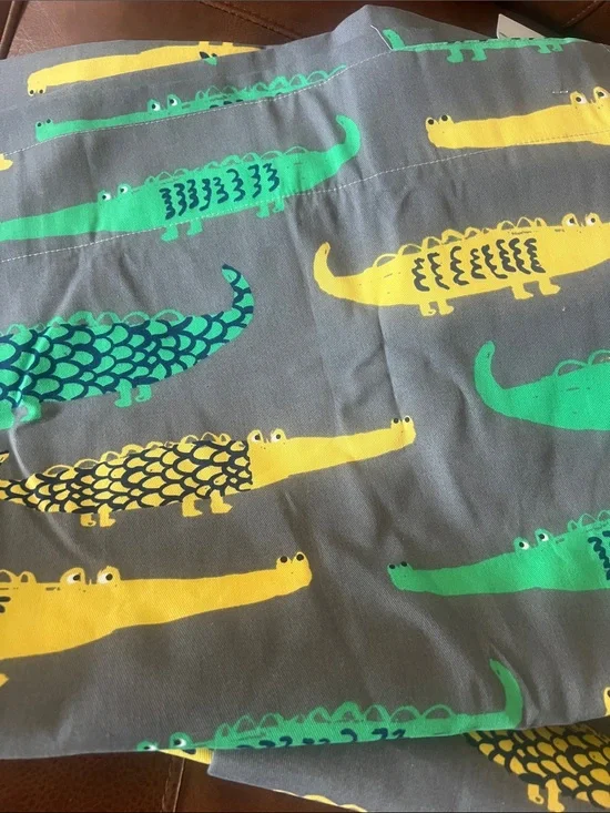 Pillowfort lined Curtain Panels with Yellow and Green Alligator Print.