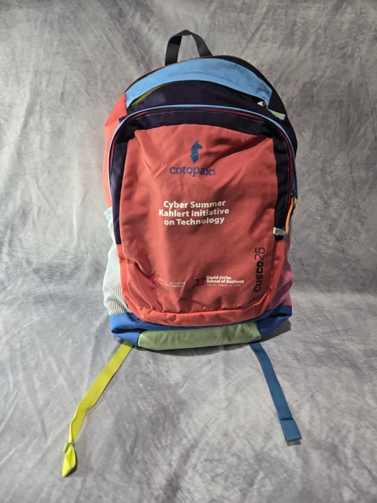 cotopaxi Red Multicolor Cusco25 Backpack with Blue and Yellow Accents