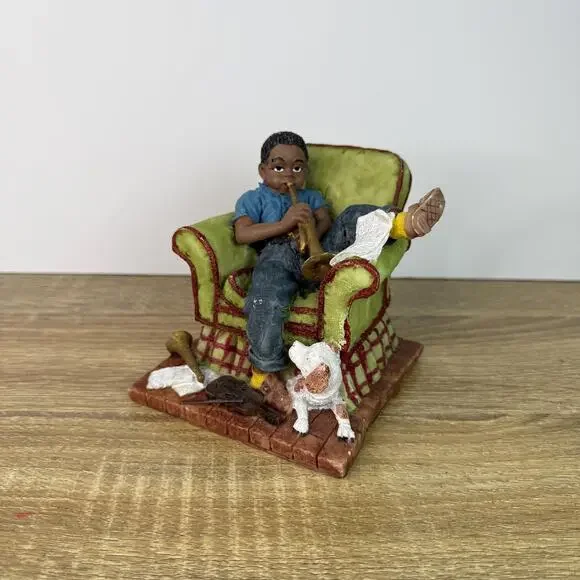 Vintage Boy Figurine Sitting On Chair with Saxophone and Dog Figure