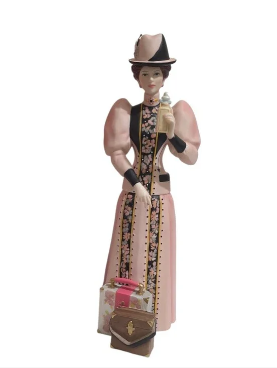 2004 Avon Mrs. PFE Albee President's Club Award porcelain figurine.