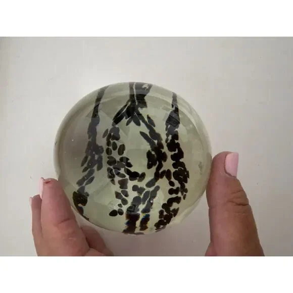 Vintage art glass paperweight with black Inclusions