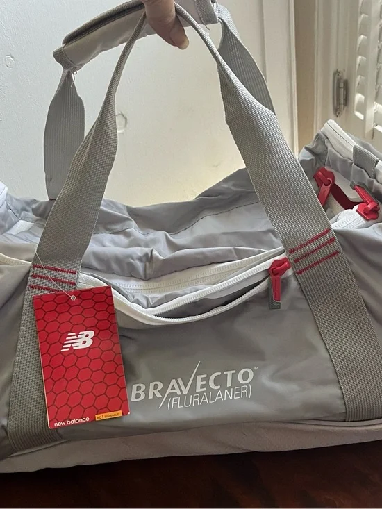 New Balance Gray and Red Bravecto Duffel Bag