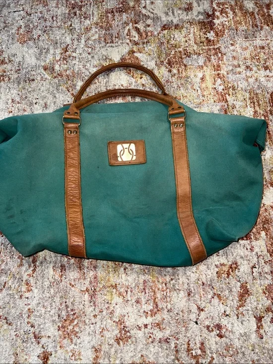 Vintage green duffle bag with leather handles