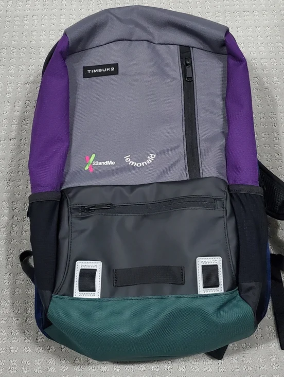 Timbuk2 Alcatraz Laptop Backpack, featuring branding from 23andMe and Lemonade