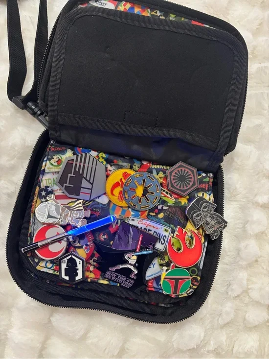 Disney Parks Star Wars Pins Collection and Pin Trading Bag/Book light up saber