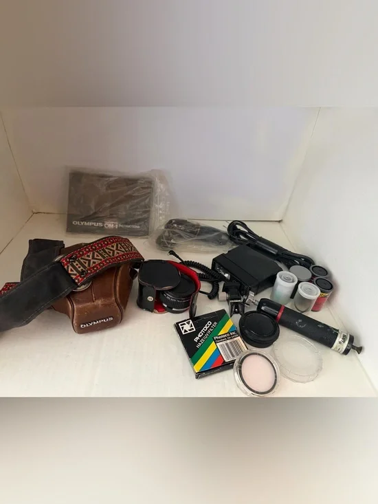 Olympus OM 1 SLR film camera with Original Leather  Case and Accessories