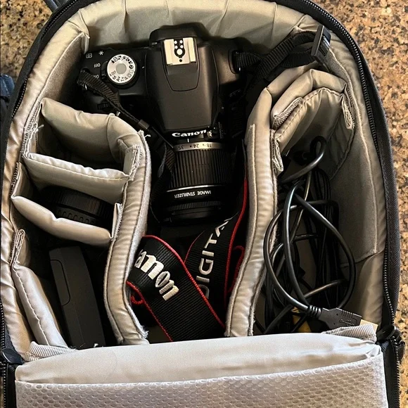 Canon rebel t1i dslr camera with backpack camera bag and battery charger