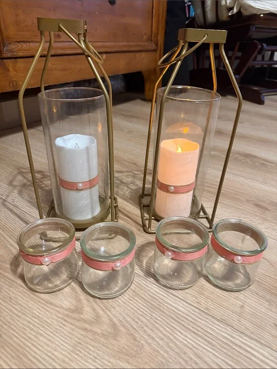 2 hurricane lamps with battery operated candles, and 4 tealight holders
