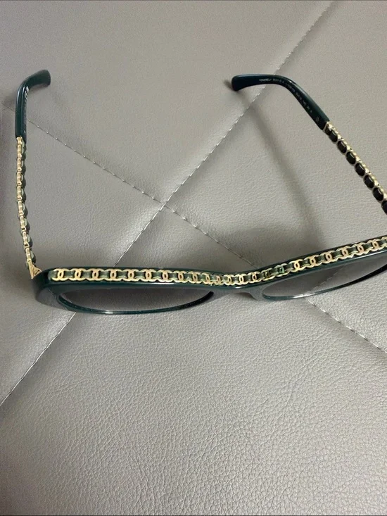 Chanel sunglasses. 100 percent authentic. Dark green with gold accents.