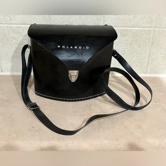 Vintage Polaroid Swinger camera and case