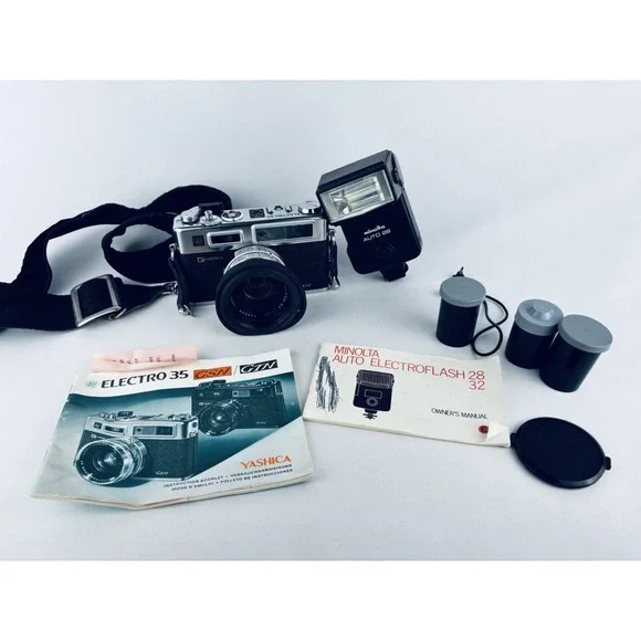 Yashica Vintage Electro 35 GSN Camera & Minolta Electroflash 28 & Film & Books