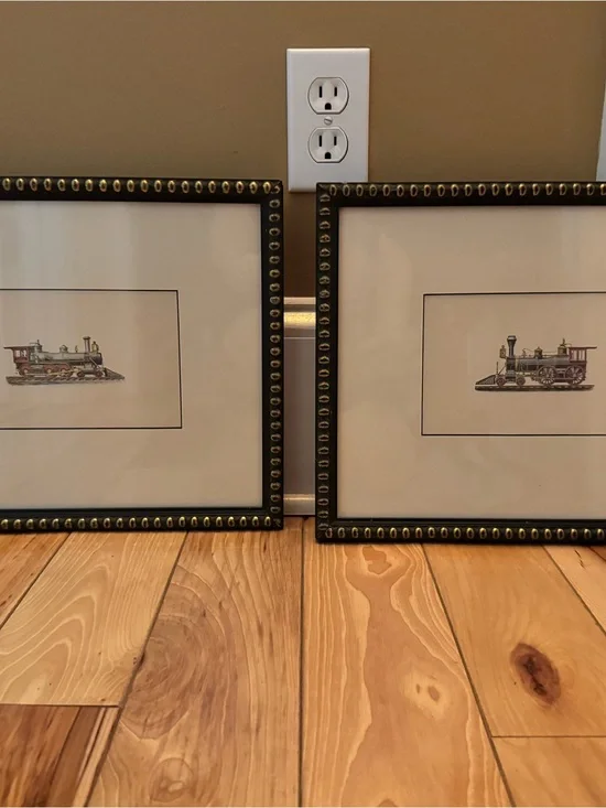 Locomotive matted print in black decorative frame with brass stud look accents