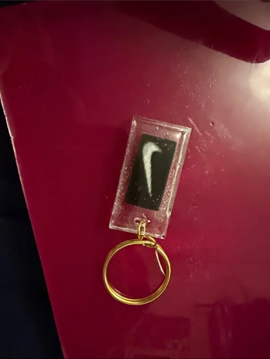Nike Clear Resin Keychain with Black Swoosh and Gold Ring
