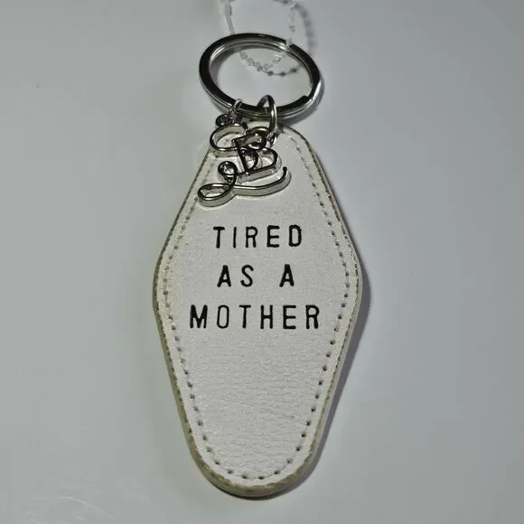 Santa Barbara Design Studio Silver Tone White Leather Tired As A Mother Keychain