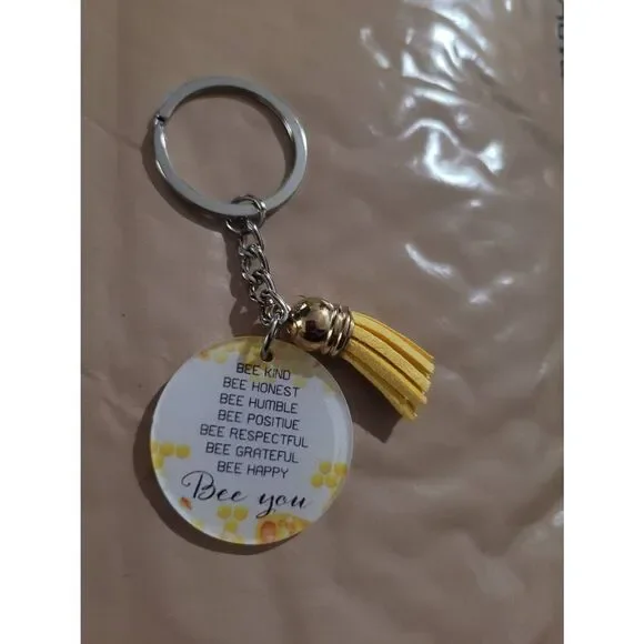 Be you. Positive yellow keychain with mini tassel