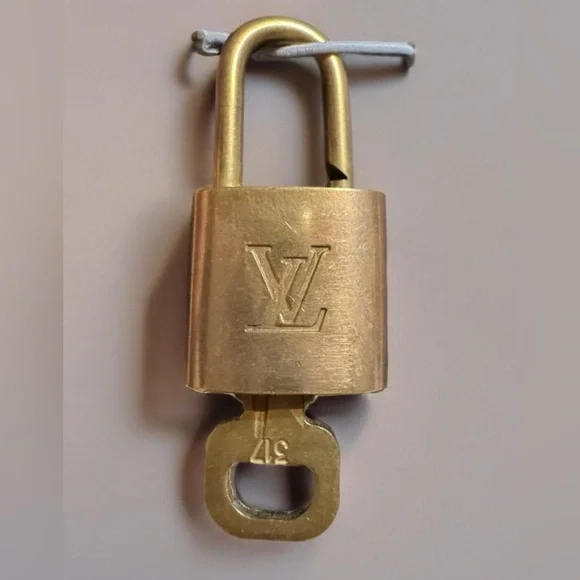 Louis Vuitton GOLD Lock & Key Gold tone Authentic. Number 317 MSRP $300