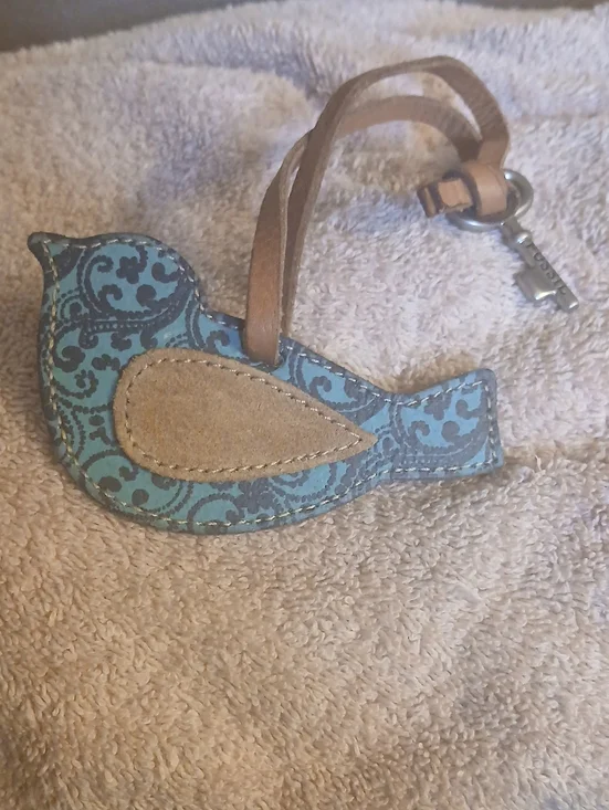 Fossil blue paisley leather bird keychain bag charm featuring a silver-toned key