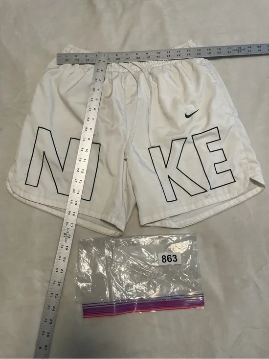 Nike White Shorts with Black Outlined NIKE Lettering